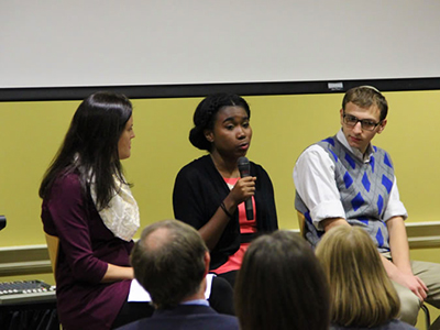 Three UMD students in a panel discussion