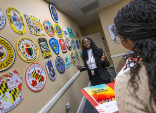 students talk in a state house conference room