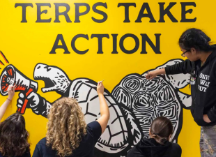 studnets paint terps take action mural