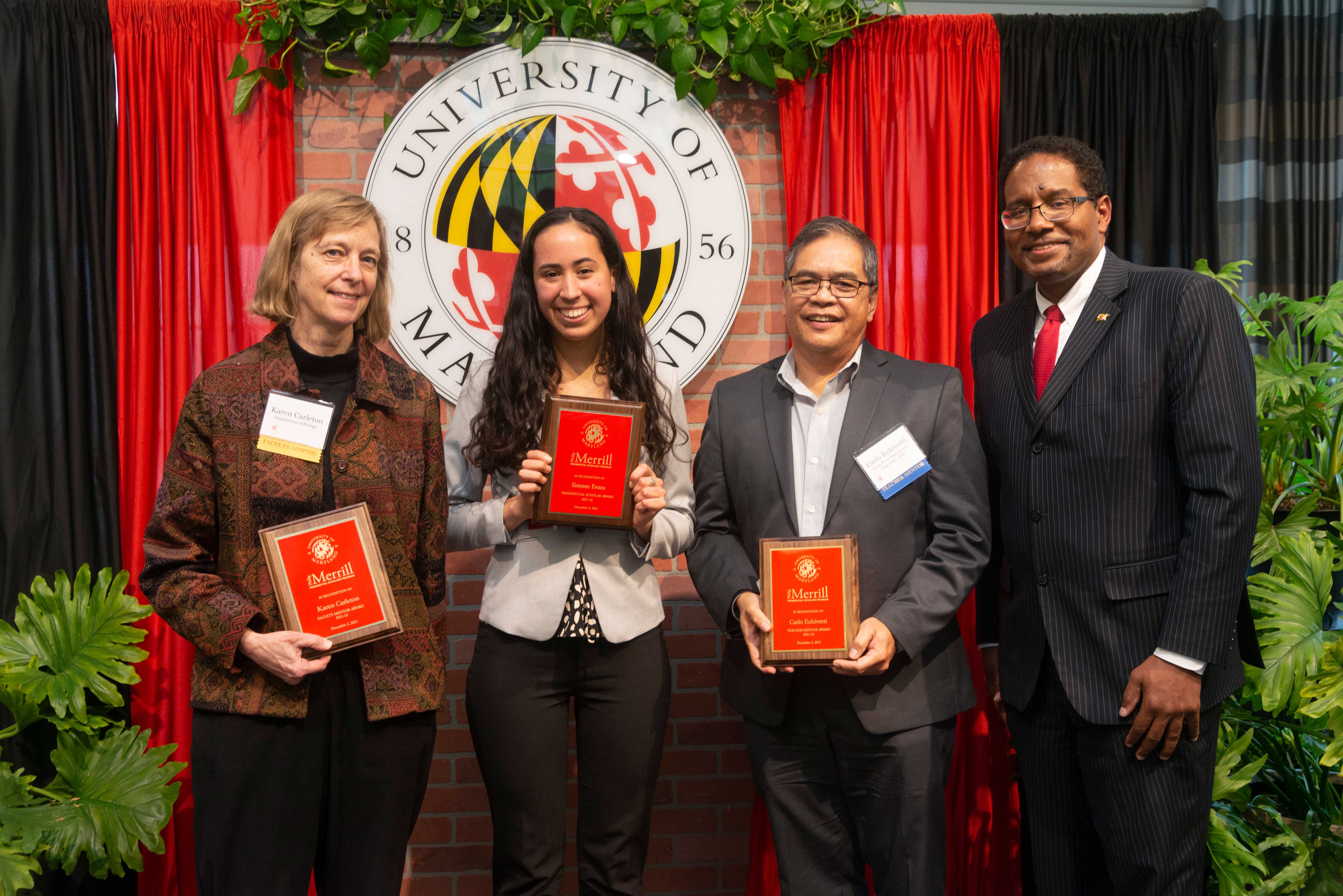 Merrill Scholar Simone Evans with mentors and President Pines